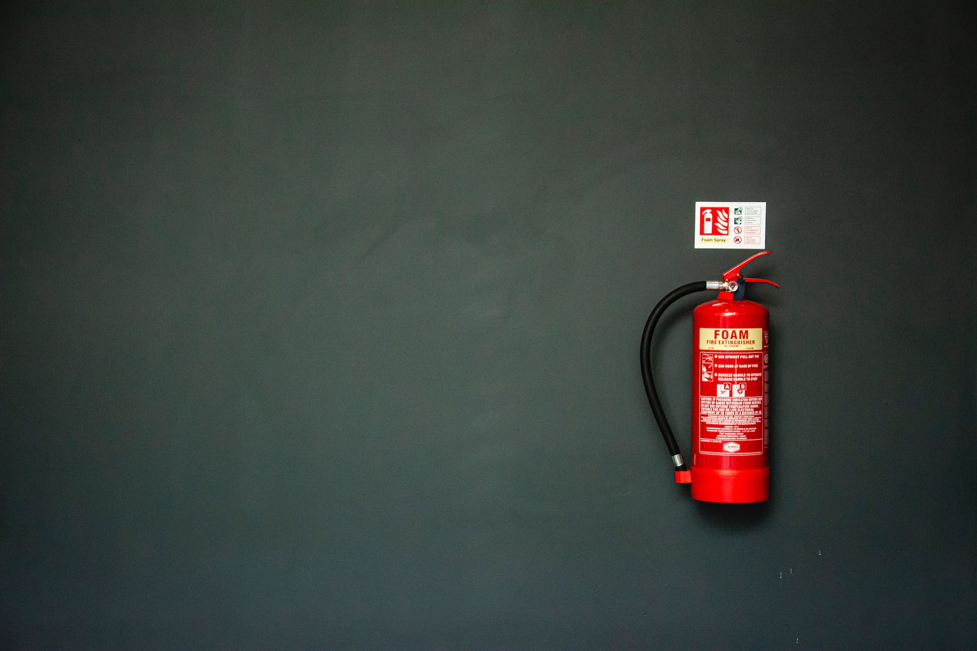 A fire extinguisher on the wall